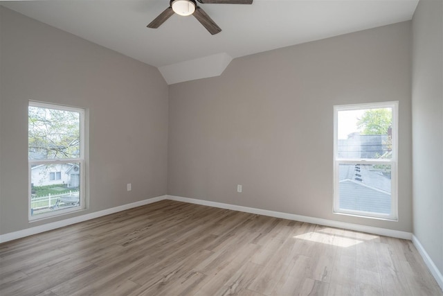 510 E Washington St, Pontiac, IL 61764 - unfurnished room featuring a ceiling fan, light wood-style flooring, vaulted ceiling, and baseboards