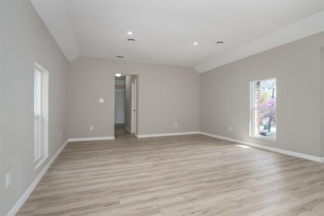 510 E Washington St, Pontiac, IL 61764 - spare room featuring light wood-type flooring, recessed lighting, vaulted ceiling, and baseboards