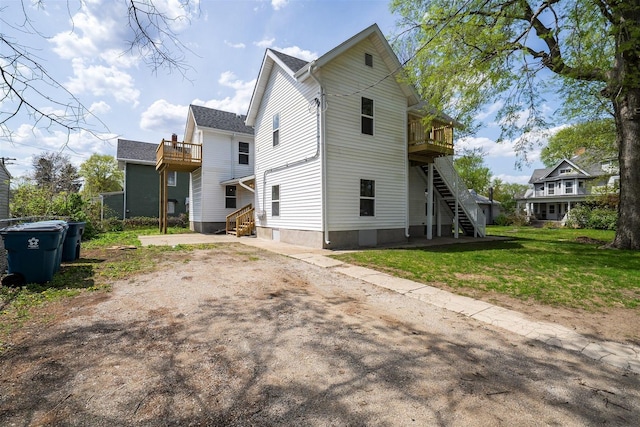 510 E Washington St, Pontiac, IL 61764 - exterior space with a yard, stairs, and a balcony