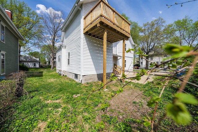 510 E Washington St, Pontiac, IL 61764 - view of side of home with a wooden deck and a yard