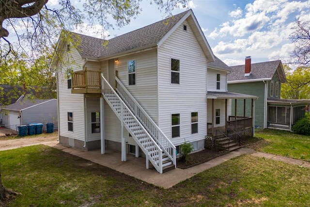 510 E Washington St, Pontiac, IL 61764 - back of property with stairs, a yard, and a shingled roof