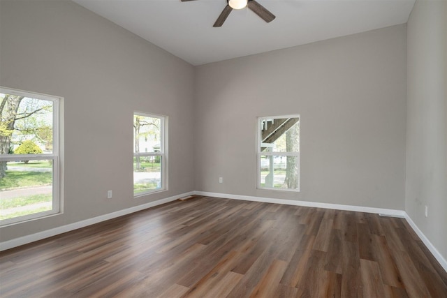 510 E Washington St, Pontiac, IL 61764 - unfurnished room featuring dark wood-type flooring, ceiling fan, and baseboards