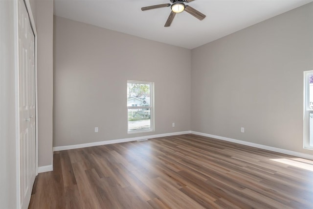 510 E Washington St, Pontiac, IL 61764 - spare room featuring wood finished floors, a ceiling fan, and baseboards