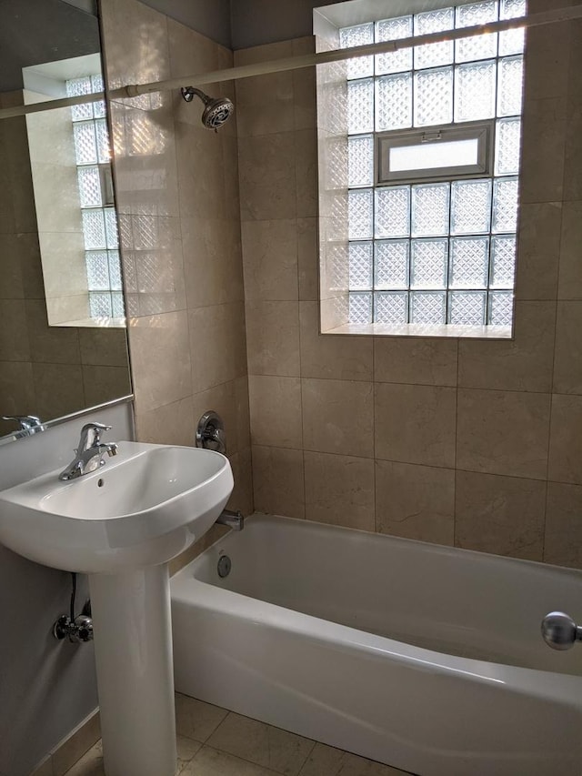 bathroom with tile patterned floors and tub / shower combination
