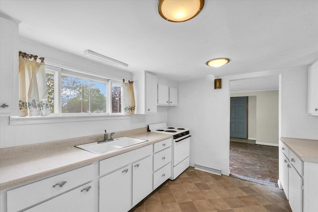 kitchen with a sink, white cabinetry, light countertops, and white electric stove