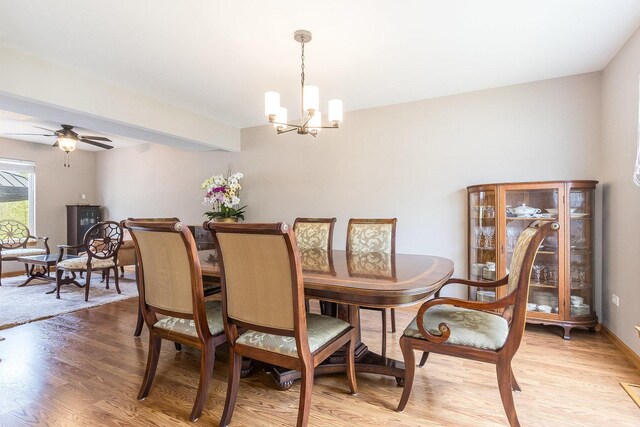 1518 Parkside Dr, Plainfield, IL 60586 - dining area with baseboards, light wood-type flooring, and ceiling fan with notable chandelier