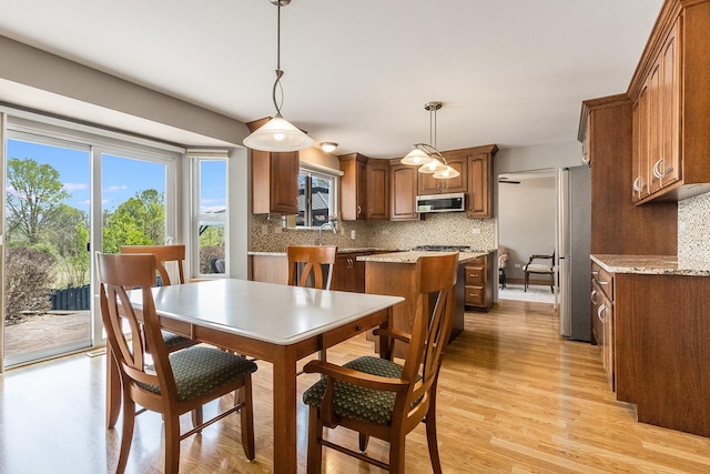 1518 Parkside Dr, Plainfield, IL 60586 - dining area with light wood-style flooring
