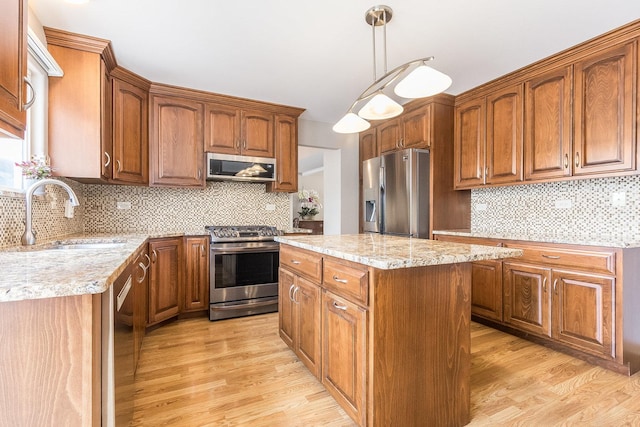 1518 Parkside Dr, Plainfield, IL 60586 - kitchen featuring a sink, tasteful backsplash, a center island, and appliances with stainless steel finishes