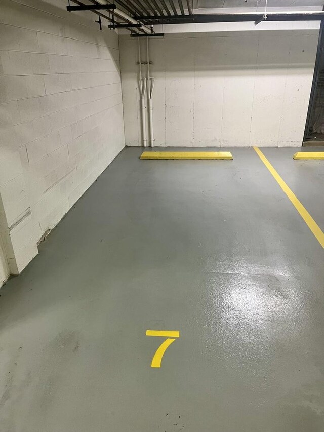 2640 Summit Dr Unit 110, Glenview, IL 60025 - parking deck featuring concrete block wall