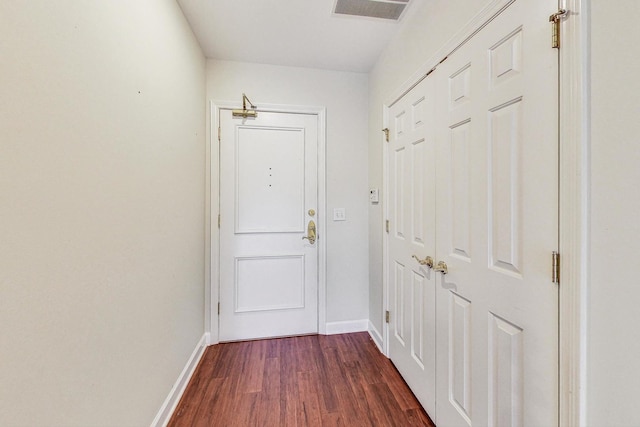 2640 Summit Dr Unit 110, Glenview, IL 60025 - doorway featuring visible vents, dark wood-style flooring, and baseboards