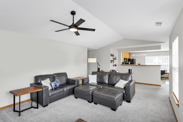 2262 Rockefeller Dr, Geneva, IL 60134 - living area with visible vents, lofted ceiling, light carpet, baseboards, and a ceiling fan