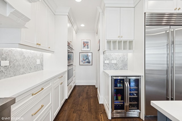 236 W Crescent Ave, Elmhurst, IL 60126 - kitchen with appliances with stainless steel finishes, beverage cooler, light countertops, recessed lighting, and white cabinetry