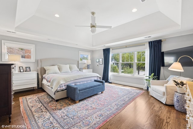236 W Crescent Ave, Elmhurst, IL 60126 - bedroom featuring a tray ceiling, wood finished floors, recessed lighting, a ceiling fan, and baseboards