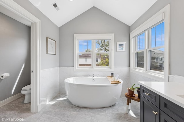 236 W Crescent Ave, Elmhurst, IL 60126 - full bathroom featuring plenty of natural light, wainscoting, toilet, a freestanding tub, and vanity