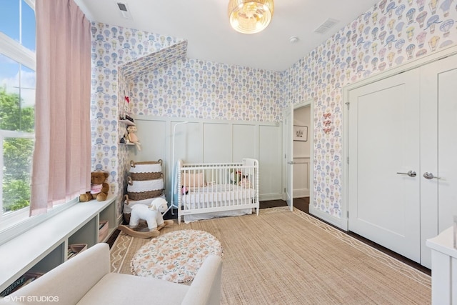 236 W Crescent Ave, Elmhurst, IL 60126 - bedroom featuring wallpapered walls, multiple windows, and a closet