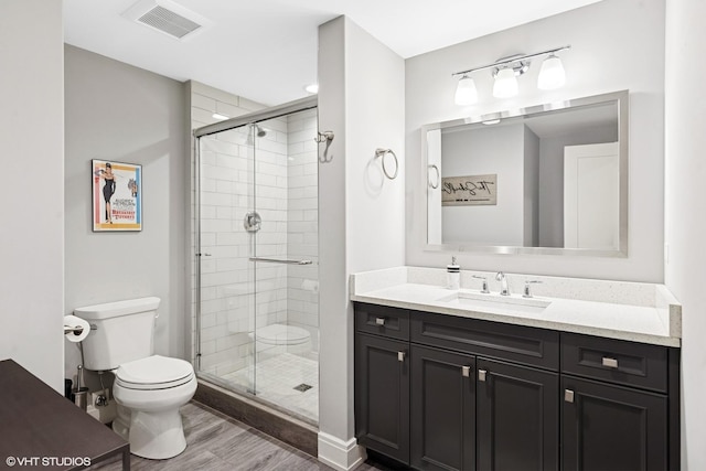 236 W Crescent Ave, Elmhurst, IL 60126 - full bathroom featuring wood finished floors, toilet, a shower stall, and vanity