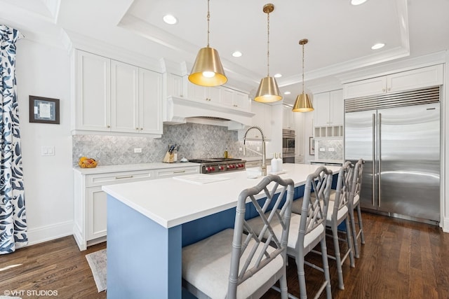 236 W Crescent Ave, Elmhurst, IL 60126 - kitchen with stainless steel appliances, dark wood-type flooring, tasteful backsplash, recessed lighting, and a kitchen island with sink
