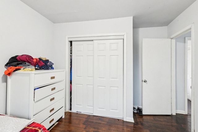 2122 Foster St, Evanston, IL 60201 - unfurnished bedroom featuring dark wood-style flooring and a closet