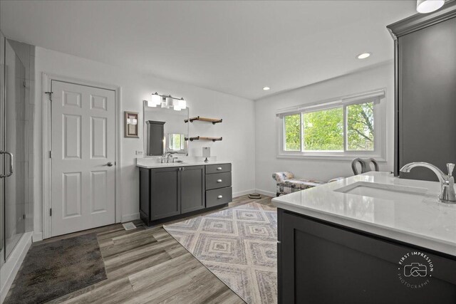 6N372 E Ridgewood Dr, Saint Charles, IL 60175 - bathroom with a shower stall, wood finished floors, two vanities, recessed lighting, and baseboards