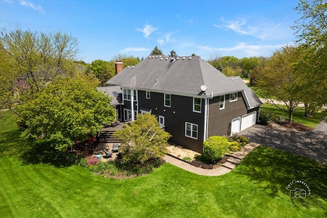 6N372 E Ridgewood Dr, Saint Charles, IL 60175 - rear view of house with a chimney, a yard, and a shingled roof