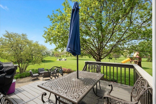 6N372 E Ridgewood Dr, Saint Charles, IL 60175 - wooden terrace with a lawn, a playground, and outdoor dining space