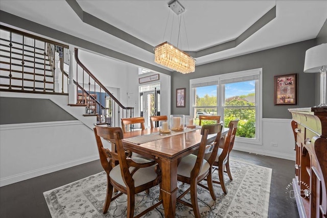6N372 E Ridgewood Dr, Saint Charles, IL 60175 - dining space with stairway, a chandelier, wainscoting, a raised ceiling, and baseboards