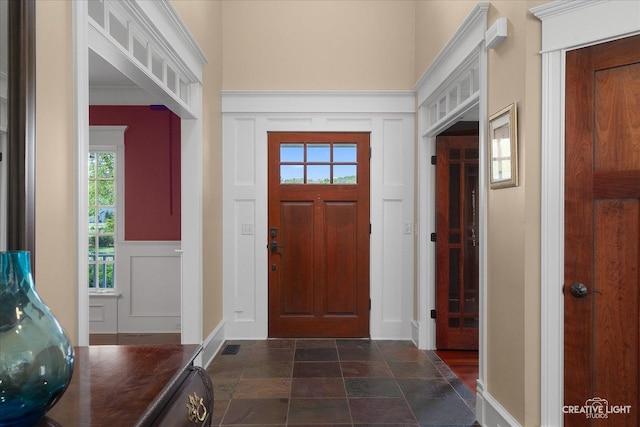 5900G Red Gate Ln, Yorkville, IL 60560 - foyer entrance with a decorative wall, dark stone finish floors, and wainscoting