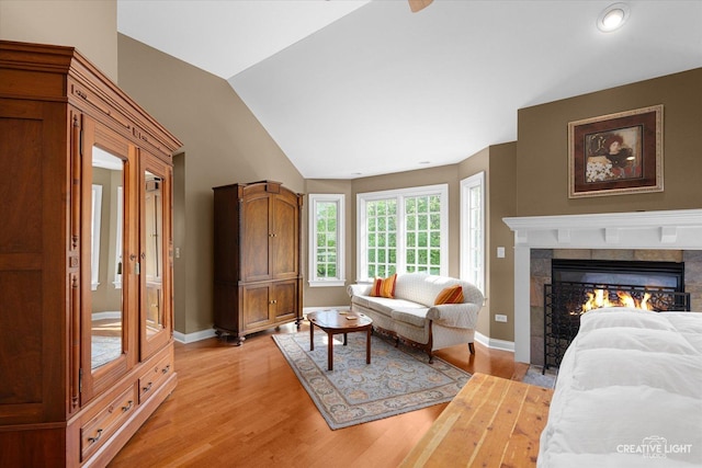 5900G Red Gate Ln, Yorkville, IL 60560 - living room with light wood-style flooring, lofted ceiling, baseboards, a glass covered fireplace, and recessed lighting