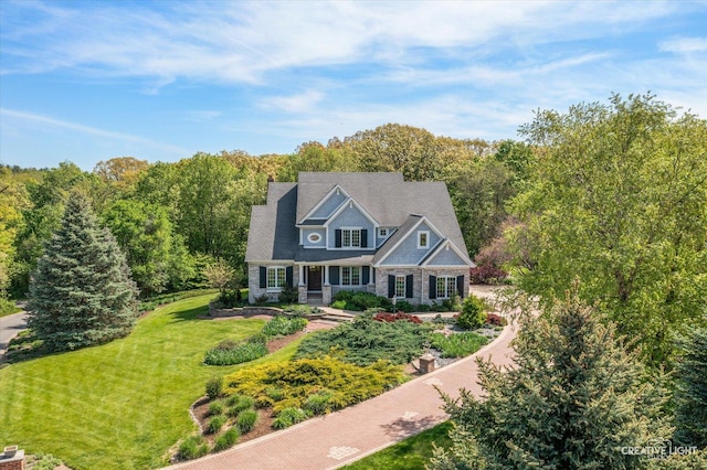 5900G Red Gate Ln, Yorkville, IL 60560 - view of front of home featuring a front yard, a forest view, and a porch