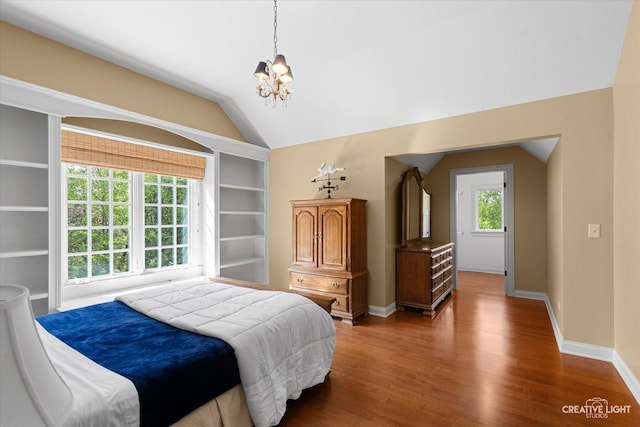 5900G Red Gate Ln, Yorkville, IL 60560 - bedroom featuring a chandelier, wood finished floors, vaulted ceiling, and baseboards