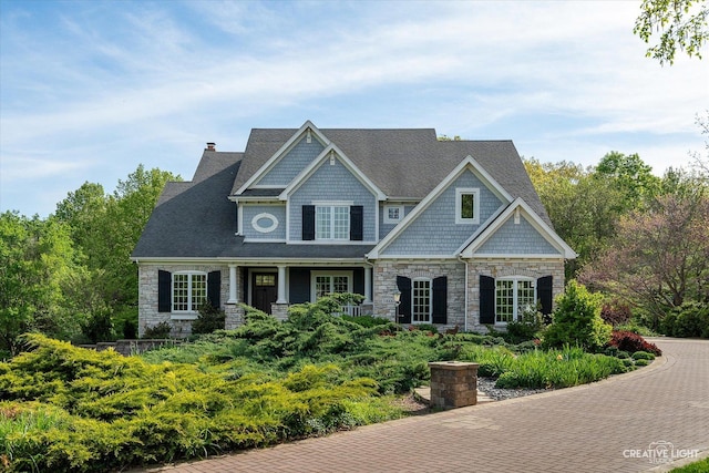 5900G Red Gate Ln, Yorkville, IL 60560 - craftsman inspired home featuring stone siding, a chimney, a shingled roof, and covered porch
