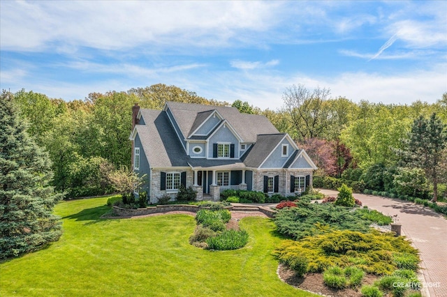 5900G Red Gate Ln, Yorkville, IL 60560 - shingle-style home with stone siding, a front lawn, and a chimney
