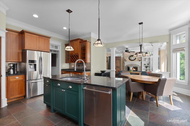 5900G Red Gate Ln, Yorkville, IL 60560 - kitchen featuring stainless steel appliances, a sink, ornate columns, a brick fireplace, and tasteful backsplash