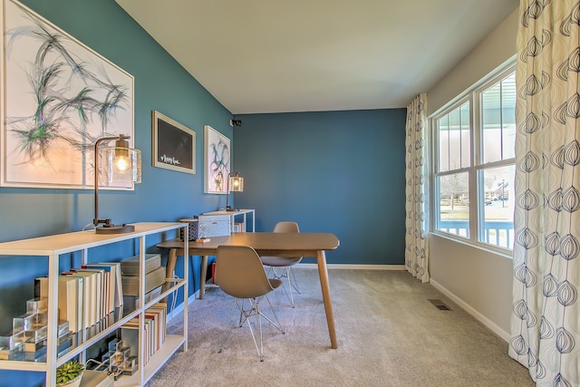 office featuring carpet, visible vents, and baseboards