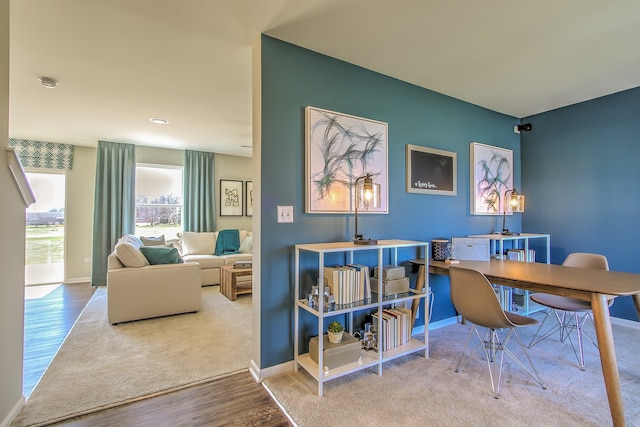 interior space with baseboards and wood finished floors