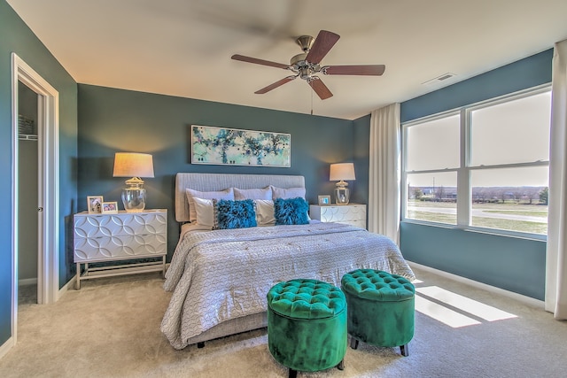 bedroom featuring baseboards, visible vents, ceiling fan, and carpet floors