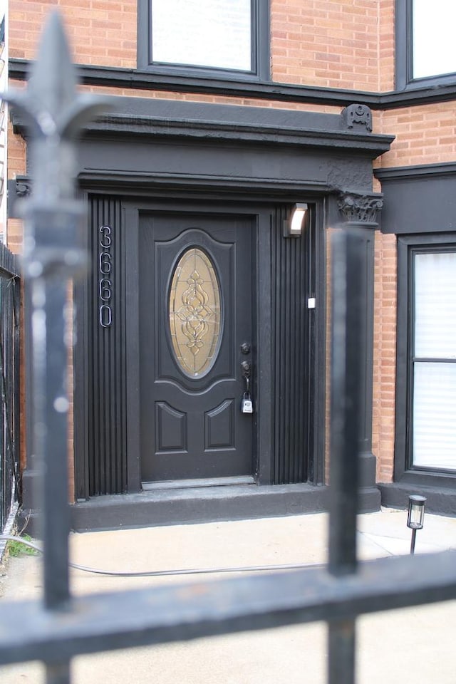 property entrance with brick siding