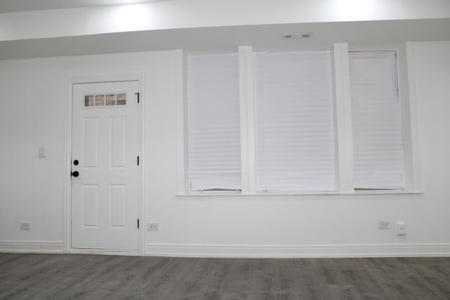 details featuring baseboards, wood finished floors, and visible vents