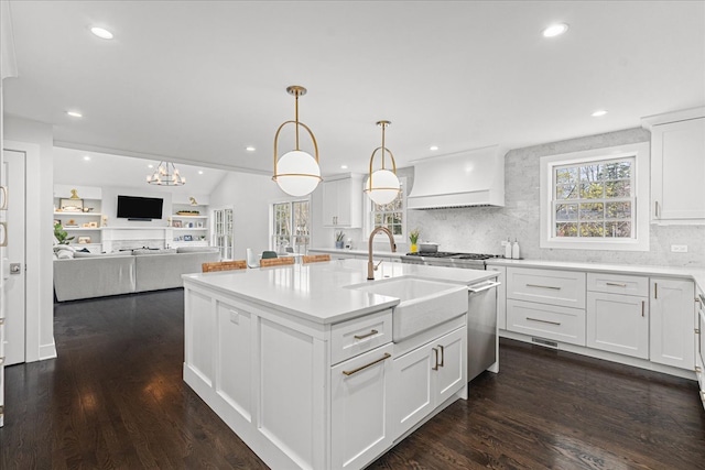 130 Ravine Forest Dr, Lake Bluff, IL 60044 - kitchen with white cabinets, a sink, custom exhaust hood, a kitchen island with sink, and backsplash