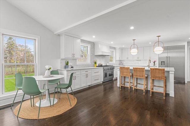 130 Ravine Forest Dr, Lake Bluff, IL 60044 - kitchen featuring custom exhaust hood, high quality appliances, tasteful backsplash, and light countertops