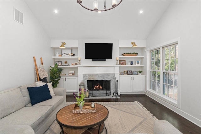 130 Ravine Forest Dr, Lake Bluff, IL 60044 - living area with dark wood finished floors, recessed lighting, visible vents, a fireplace with flush hearth, and lofted ceiling