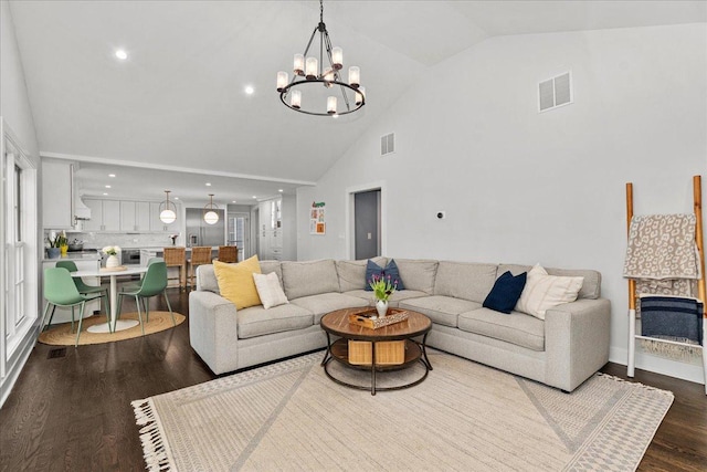 130 Ravine Forest Dr, Lake Bluff, IL 60044 - living room with visible vents, high vaulted ceiling, dark wood-style floors, and a notable chandelier