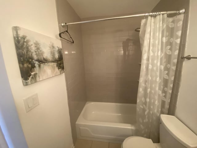 full bathroom with tile patterned floors, shower / tub combo, and toilet