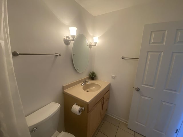 bathroom with tile patterned floors, toilet, and vanity