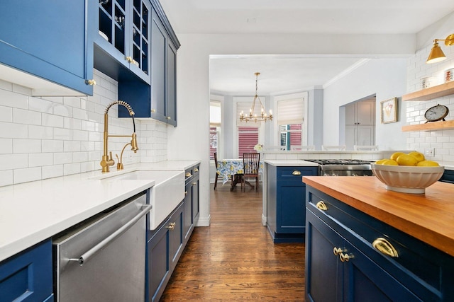 kitchen featuring open shelves, decorative backsplash, blue cabinets, wood counters, and stainless steel appliances