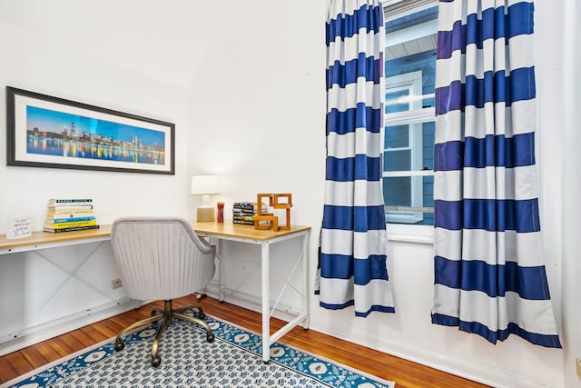 office featuring baseboards and wood finished floors
