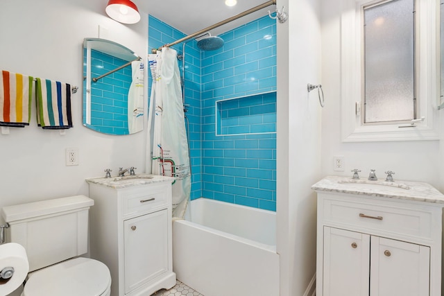 bathroom with vanity, shower / bath combo with shower curtain, and toilet