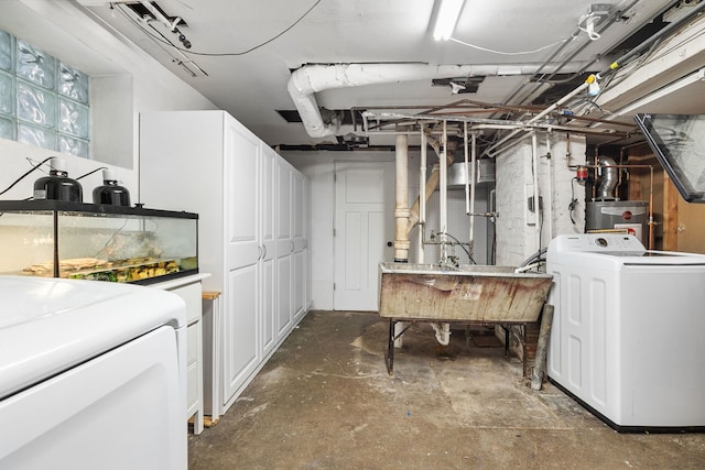 below grade area featuring washer / dryer, a sink, and water heater