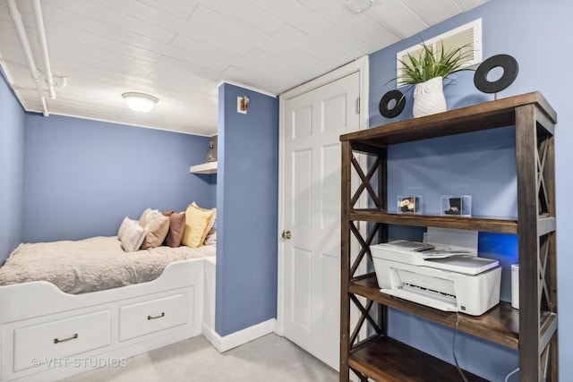 bedroom featuring wooden ceiling and baseboards