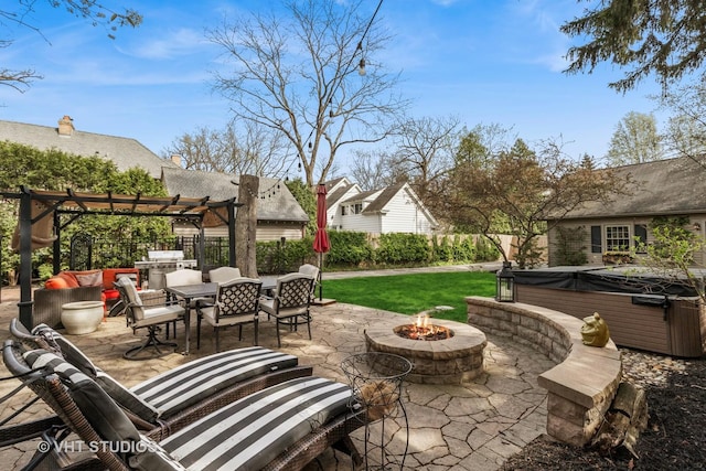 view of patio featuring a hot tub, a pergola, fence, and an outdoor living space with a fire pit